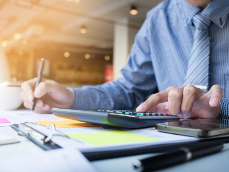 business-finance-man-calculating-budget-numbers-invoices-financial-adviser-working